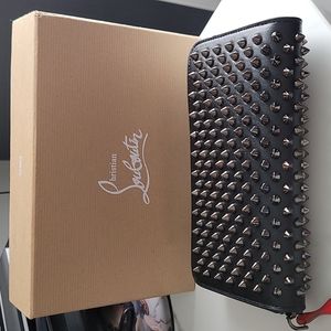 Christian Louboutin Panettone Wallet Black /Red . Used in a great condition